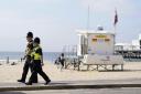 File image of police officers walking along a stretch of Bournemouth sea front