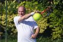 Ed Davey playing tennis in St Ann's Well Gardens in Hove