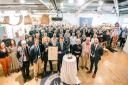 The Island's Lord Lieutenant Susie Sheldon with the staff and management of AJ Wells & Sons Ltd, celebrating receipt of the King's Award for Enterprise, at the company's Newport studio.