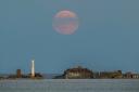 The harvest supermoon over Portland Breakwater