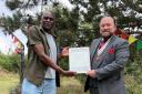 James (left), who was formerly homeless, was recognised for his contributions to Watford Peace Garden, in Cassiobury Park, at a meeting of the Watford Interfaith Association