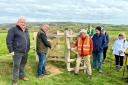 High Sheriff Graham Biss opening the new gate, alongside Will Myles, managing director of Visit IW, left, and David Howarth from the Ramblers