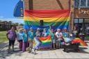 Matt Prosser (Dorset Council's Chief Executive), stands with members of the Chesil Youth Pride working group, including the Dorset Music Hub, The Drop-In (Portland), Space Youth Project, Weymouth College and the Youth Voice team in July