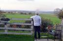 Iain McInnes, who lives next to the proposed development site at Westgate Hill, looks out onto scenic fields that could become a housing site if a developer goes ahead with a planning application