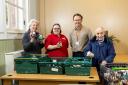 Residents Carol Brown and Ben Crofton with Canford Chase companionship team Leader Vicky Day and food bank project manager Ian Stoney