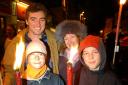 Alistair Scott, his partner Georgina and sons Thom and James await the start of the torchlit procession from Winchester Broadway to the fireworks display in North Walls recreation ground on Saturday T4068A photo Terry Bond