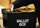 File photo dated 06/05/10 of a voter placing a ballot paper in the ballot box. More than half of people say climate change will influence the way they vote in the next general election, a survey suggests..