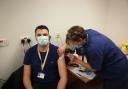 Doctor William Holdich, one of the first staff at University Hospitals Dorset to be vaccinated against Covid-19, receiving the jab from Doctor Alyson O’Donnell, UHD chief medical officer, on Wednesday, December 30