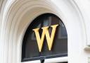 Waterstones 'W' hanging above one of its branches. Credit: PA