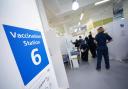 Nurses working at a vaccination site in Liberty Shopping Centre, Romford, east London, as the Government accelerates the Covid booster programme to help slow down the spread of the new Omicron variant. (PA)