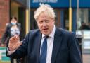 A new image has been released with Boris Johnson shown to be next to an open bottle of fizz at a Downing Street Christmas quiz (PA)