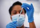 A medical professional preparing a Covid vaccine. Credit: PA