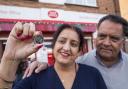 Postmaster Umesh Sanghani and wife Rashmita, of Dedworth Green Post Office in Windsor, with the new new Platinum Jubilee 50p coin. Picture: PA