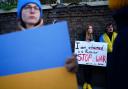 A woman claiming to be a Tatar (centre), a Turkic ethnic group native to the Volga-Ural region of Russia, protests against the Russian invasion of Ukraine outside the Russian Embassy in Kensington, London.