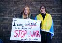 A woman claiming to be a Tatar, a Turkic ethnic group native to the Volga-Ural region of Russia, protests against the Russian invasion of Ukraine outside the Russian Embassy in Kensington, London. (PA)