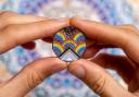 First-ever official coin created for the LGBTQ+ community. Credit: The Royal Mint