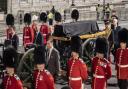 The black coffin was pulled by the King's Troop Royal Horse Artillery early this morning (PA)