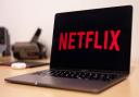 Netflix to charge users for password sharing in early 2023 (Canva)