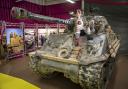 Tank Girl lookalike opens the Tanks for the Memories exhibition at The Tank Museum.