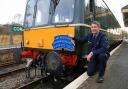 Peter Frost next to the SR Wareham Class 117 heritage diesel train at Corfe Castle, Wareham