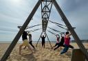 Kevin Hubble, owner of Three Sixty Fitness, leading a class on his exercise frame.