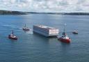 The Bibby Stockholm Barge leaving Falmouth Port this morning