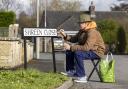 Bobby Burden Brewer gives a Dorset sign a spruce up