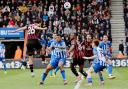 Enes Unal heads home Cherries' second goal against Brighton at Dean Court last season.