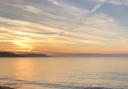 A picturesque sunrise at Bowleaze Cove