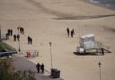 Murder probe enters third day after woman stabbed on beach - updates