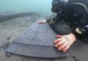 Diver with one of the gravestones.