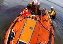 Casualty being transported from Old Harry Rocks on the inshore lifeboat