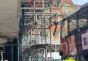 Bus crashes with scaffolding in town centre