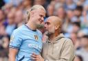 Manchester City’s Erling Haaland (left) is substituted and embraces manager Pep Guardiola during the Premier League match at the Etihad Stadium, Manchester. Picture date: Saturday August 24, 2024.