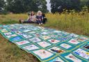 Project leaders Lara Kynvin and Beeb Deacon with the suicide memorial quilt that will be unveiled today