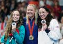 Neutral Paralympic Athletes' Viktoriia Ishchiulova holding her Silver medal, USA's Jessica Long holding her Gold medal and Great Britain's Alice Tai holding her Bronze medal won in Women's 100m Butterfly S8 Final at the Paris La Defense Arena on day Ten.