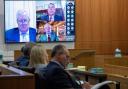 Mark Meadows, left, Stephen Binhak and Jim Eastman appear virtually during a pre-trial hearing in one of the fake electors cases (Cheryl Evans/The Daily News-Sun via AP)