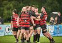 Players celebrate with MOTM Grant Hancox after winning  the match between Bournemouth and Winchester in dramatic style played at Chapel Gate, Bournemouth on Saturday 12 October 2024.  Photo taken by Simon Carlton