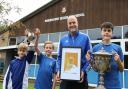 Head of PE Simon Higgins and some of his school’s silverware