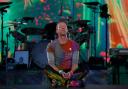 Chris Martin has fallen through a stage trapdoor while performing with Coldplay (Peter Byrne/PA)