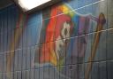 AFC Bournemouth badge in the mural on a rainbow flag before the vandalism.