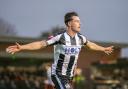 Will Fletcher celebrates scoring Wimborne's 3rd goal.