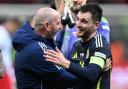 Andy Robertson (right) celebrated his late winner with Steve Clarke (Rafal Oleksiewicz/PA)