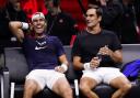 Roger Federer, right, shares a joke with Rafael Nadal (John Walton/PA)