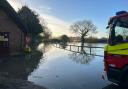 Three people were rescued in Sturminster Marshall after their vehicles became trapped in floodwater