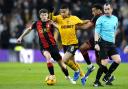 Wolverhampton Wanderers' Joao Gomes (centre) battles for the ball with Ryan Christie (left) and Tyler Adams.