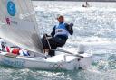 FOURTH GOLD: Ben Ainslie celebrates at the end of today's Finn medal race