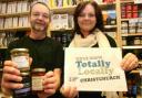 IT’S HAPPENING:  Ian Cook of Heartizans Deli in Christchurch, with Cheryl Dennett, organiser of the Totally Locally campaign