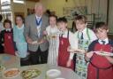 DISHING UP: Mayor of Christchurch, Cllr Peter Hall, with students from St Joseph’s Primary School