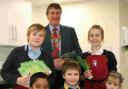 COOKS OF THE FUTURE: Dr David Rogers, president of the Rotary Club of Christchurch, with some children eager to take part in the classes